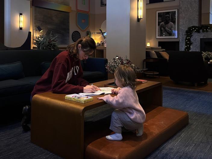  A mother and daughter relax in the Living Room.