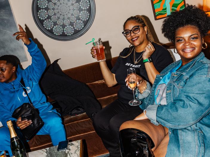 Friends raise a toast in the Living Room