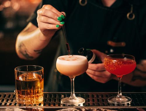 Bartender at Evening Bar Stirring Drink