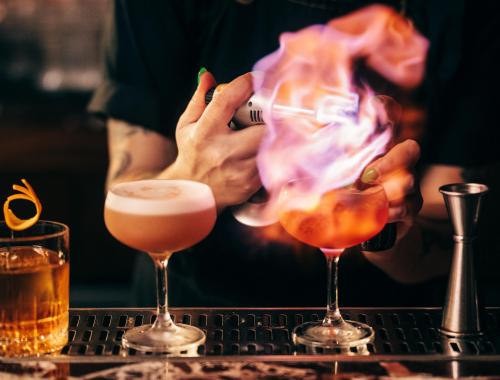 Bartender at Evening Bar smoking cocktail