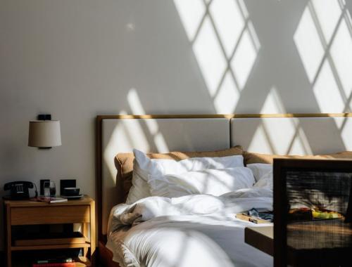 Shinola Hotel Bed with dine in meal on covers