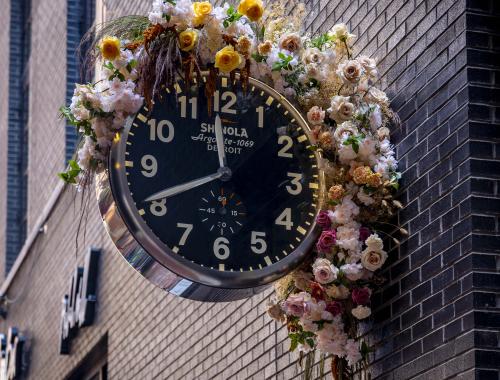 Shinola watch with flowers around it