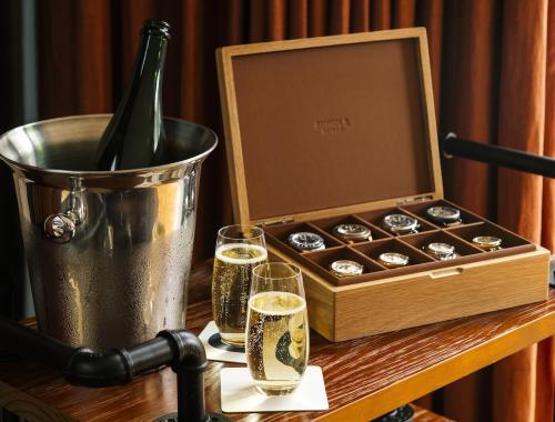 Full Shinola watch box next to champagne 