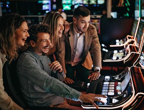 Patrons at MGM Grand Detroit using slot machine