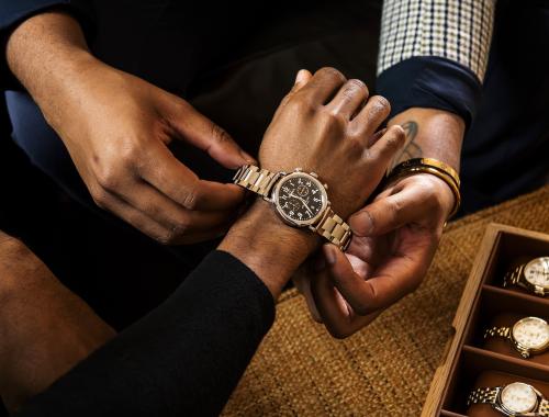 Shinola watch being fitted on resident