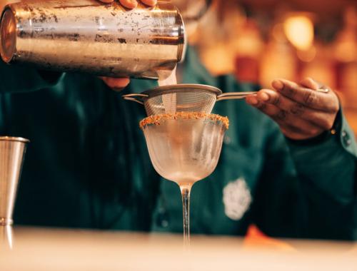 Barman pouring a drink