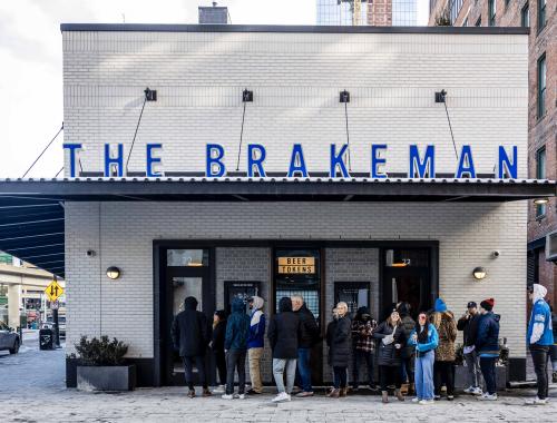 A crowd of Lions fans outside The Brakeman