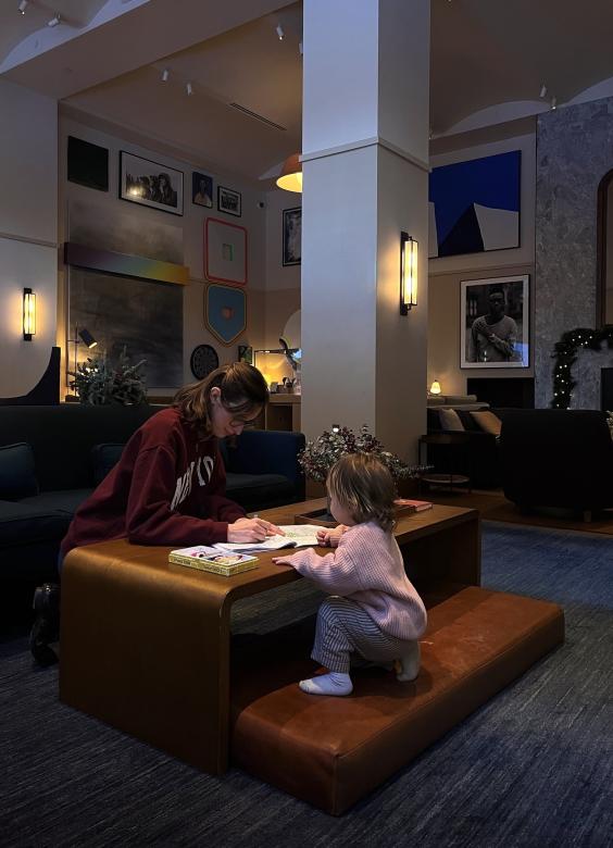 A mother and daughter relax in the Living Room.