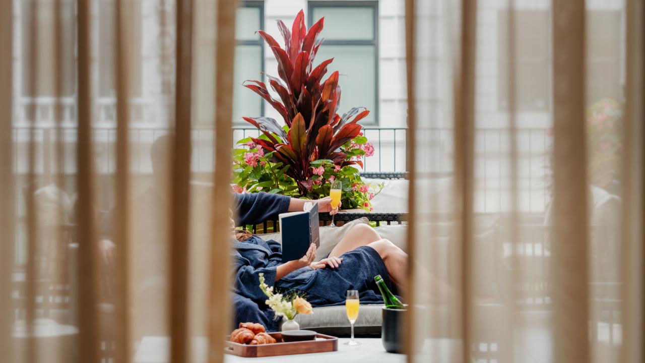 Couple lounging on Terrace in Shinola Hotel, Detroit