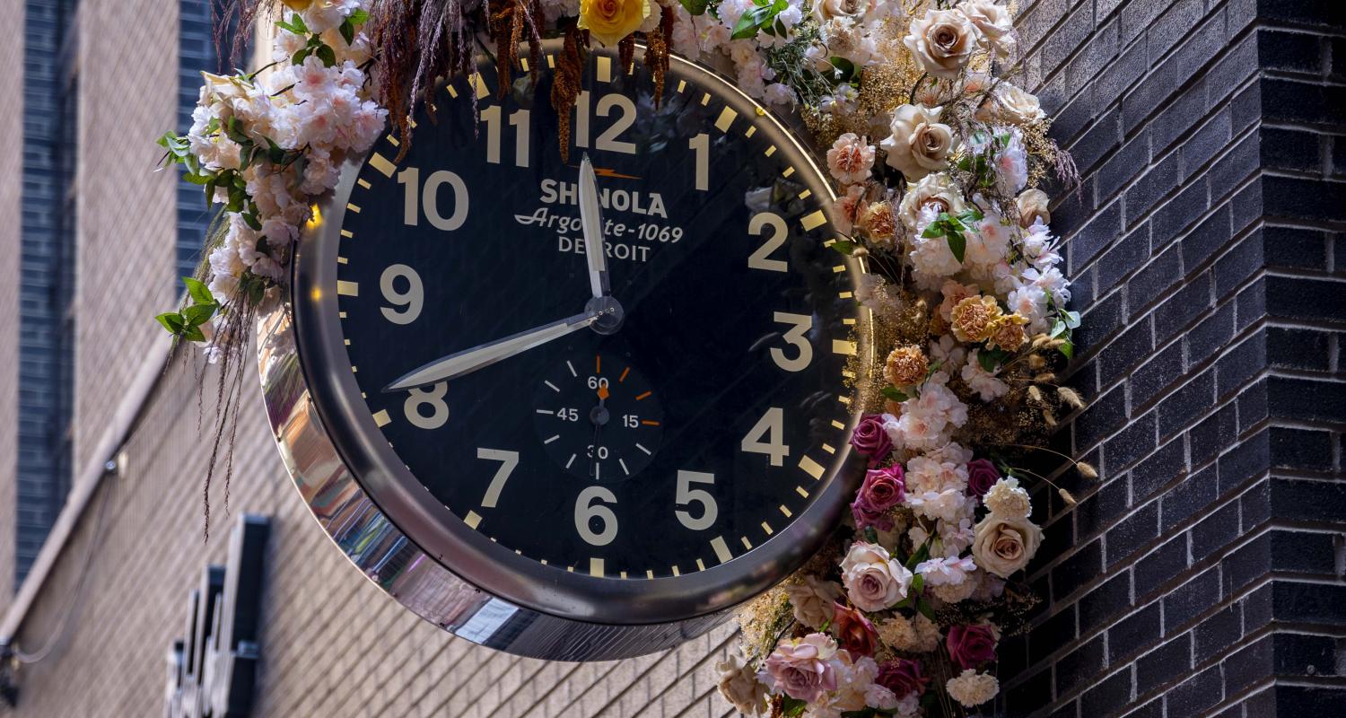 Shinola watch with flowers around it