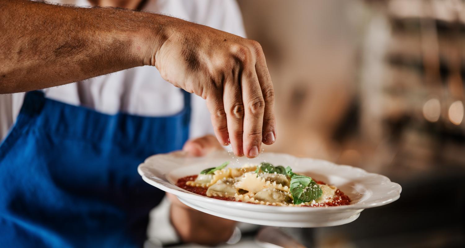 Chef finishes a dish at San Morello