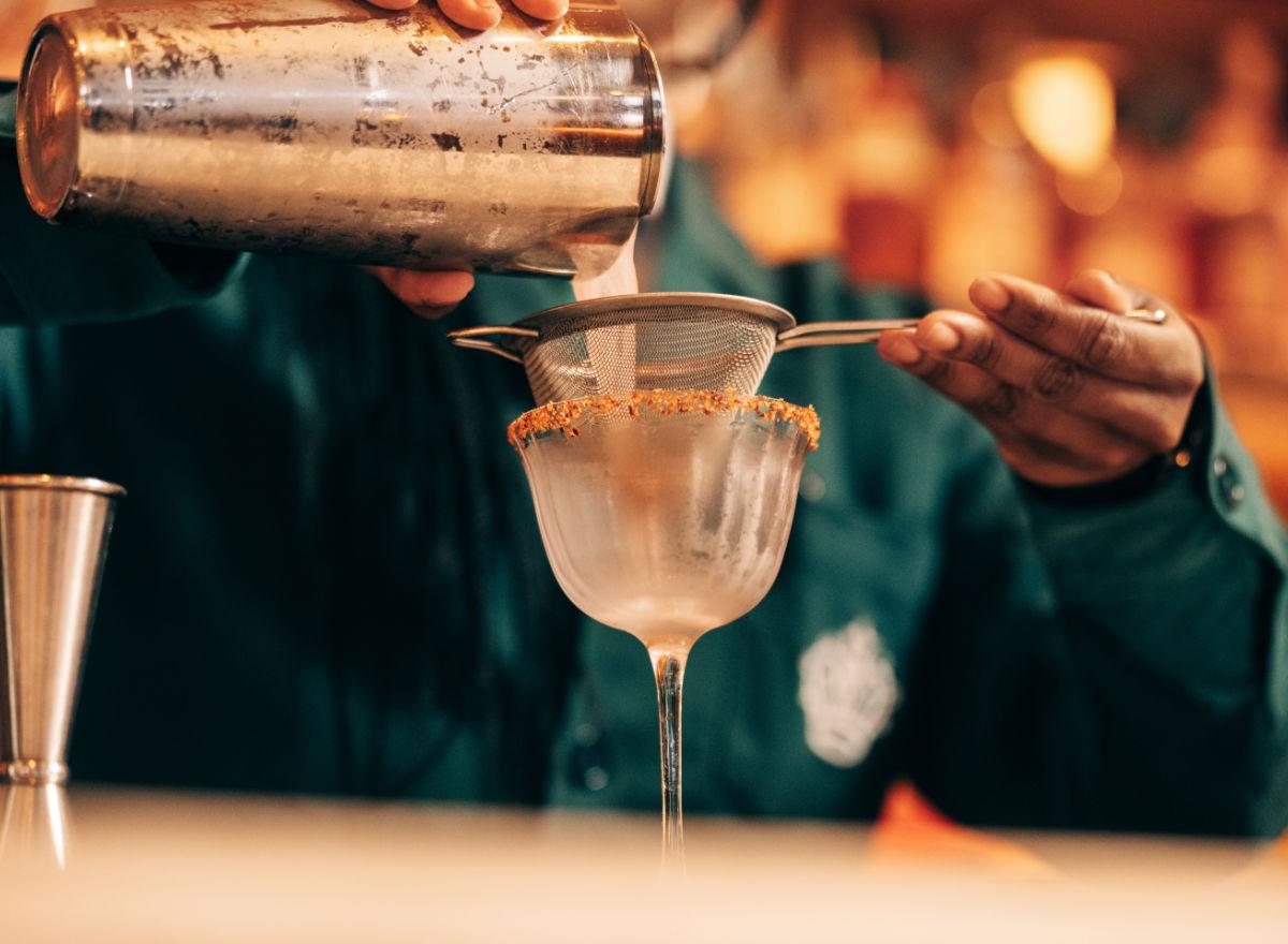 Barman pouring a drink