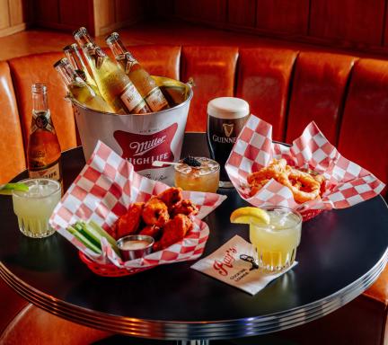 A spread of food and cocktails at Ray's in Detroit