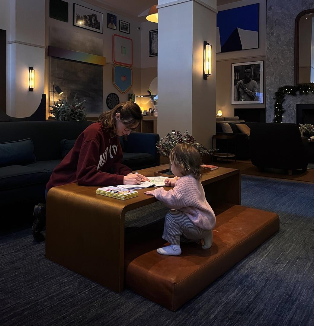  A mother and daughter relax in the Living Room.