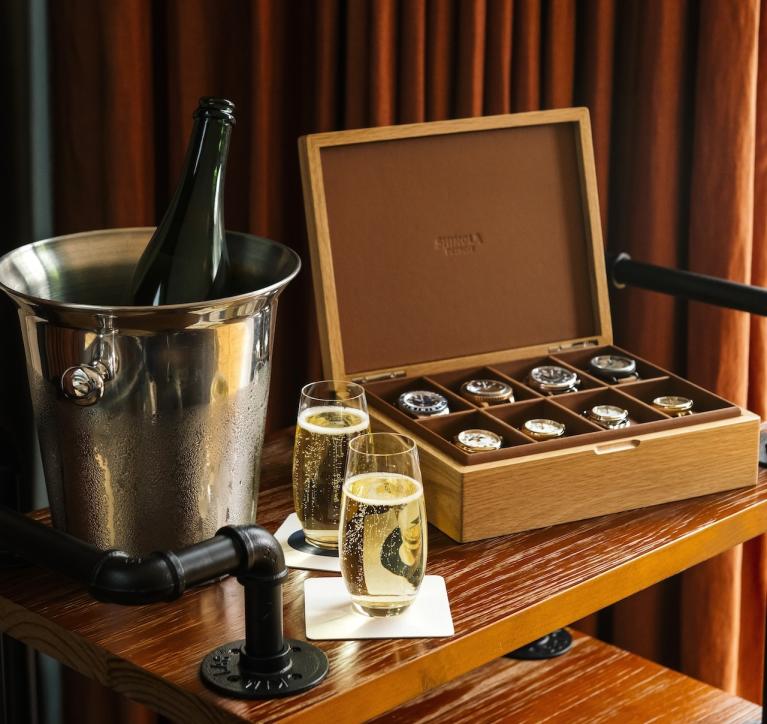 Full Shinola watch box next to champagne 
