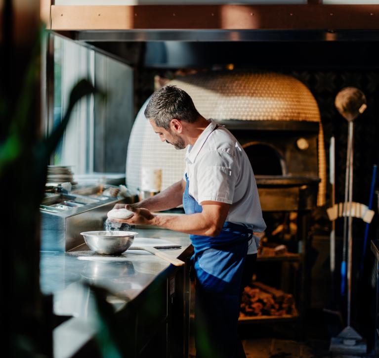 A chef prepares food in San Morello's kitchen.