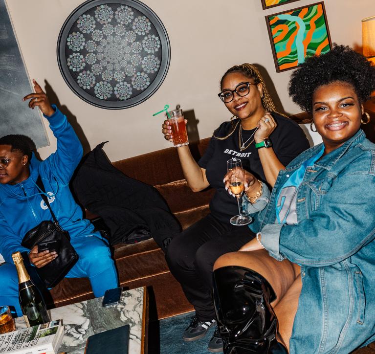 Friends raise a toast in the Living Room