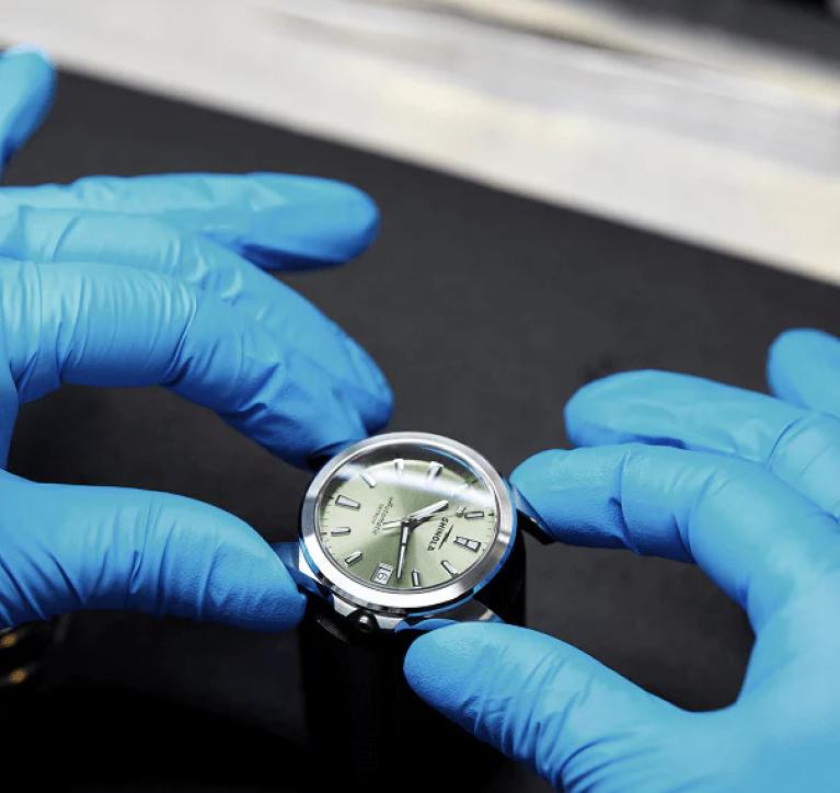An artisan builds a Shinola watch.