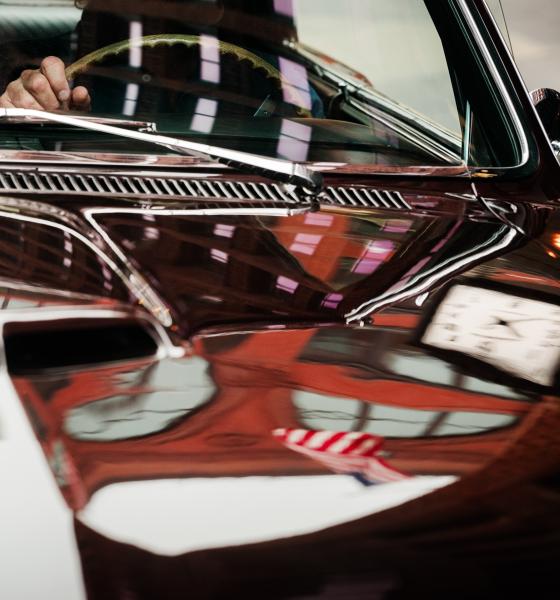 Shinola Hotel in Detroit pictured in the reflection of a car hood