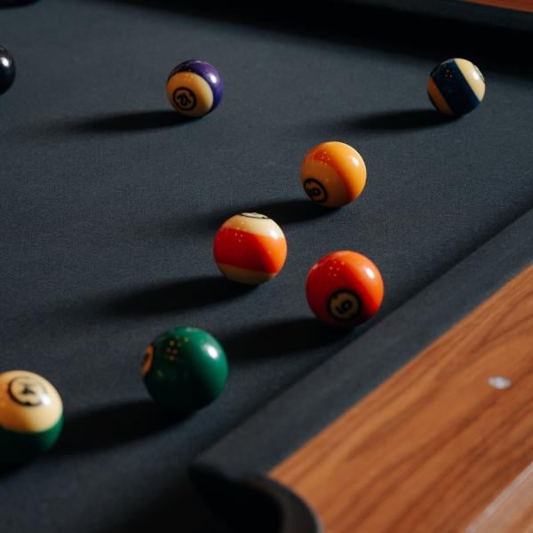Pool balls on a dark gray pool table.